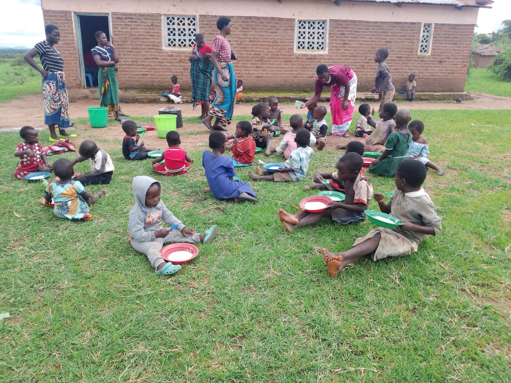 Children receiving nutritious porridge